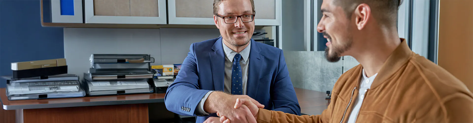 sales representative shaking hands with customer