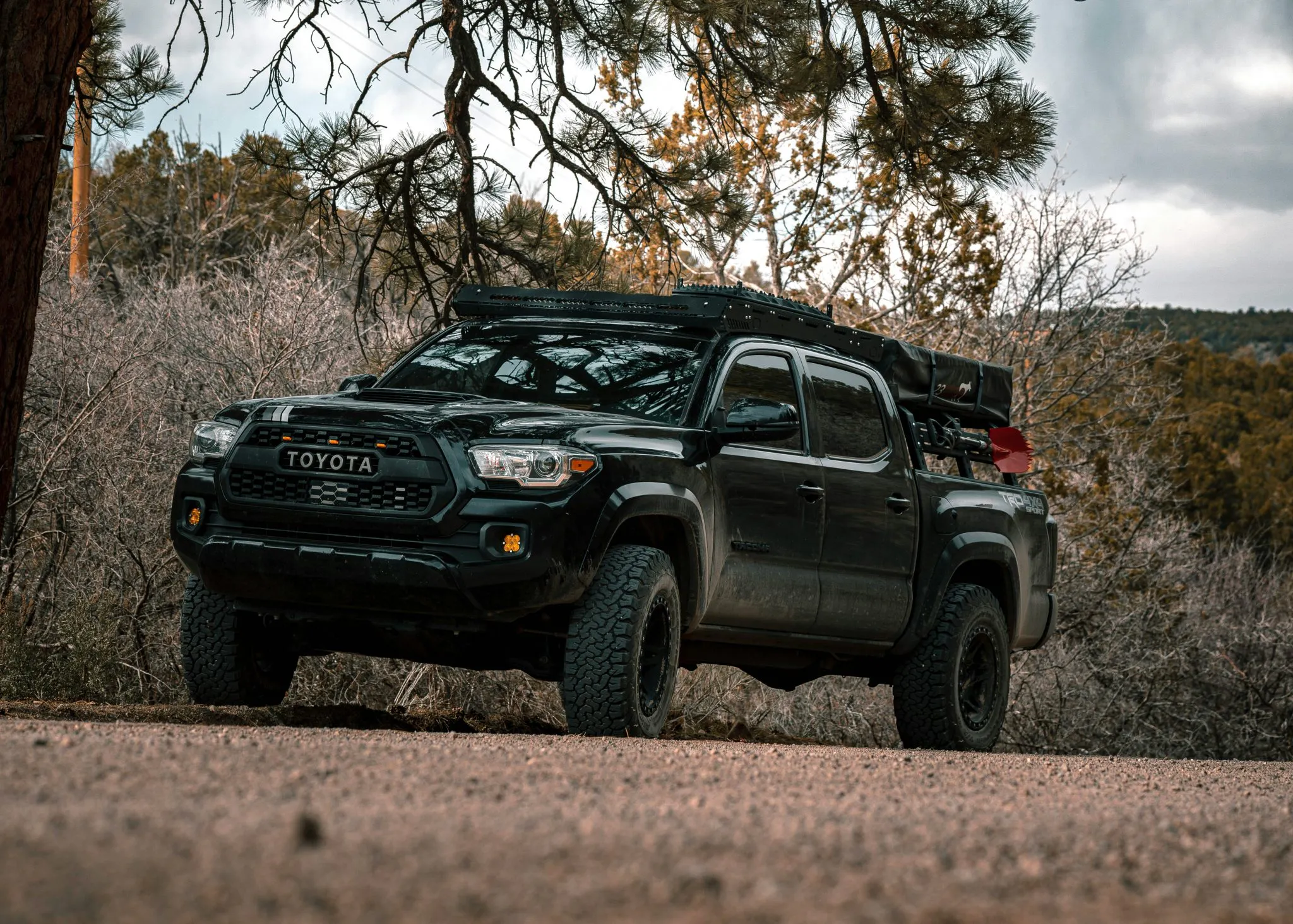 A fully customized Toyota Pick up with supplies and rack on the back