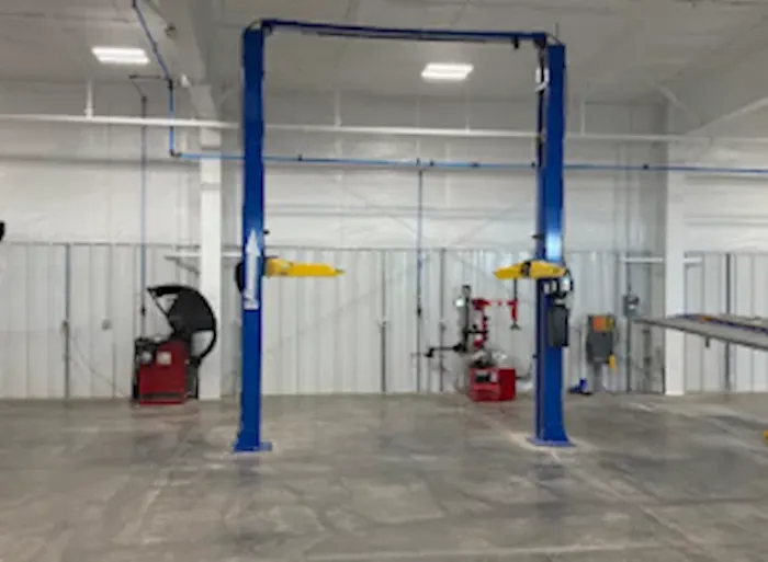 Large vehicle service equipment at a repair facility