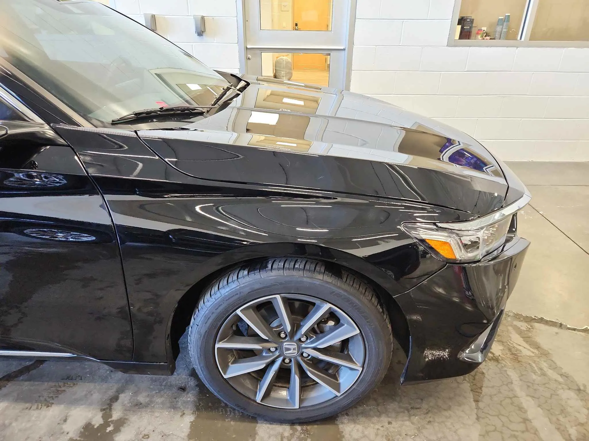 Black Honda SUV after front fender repair