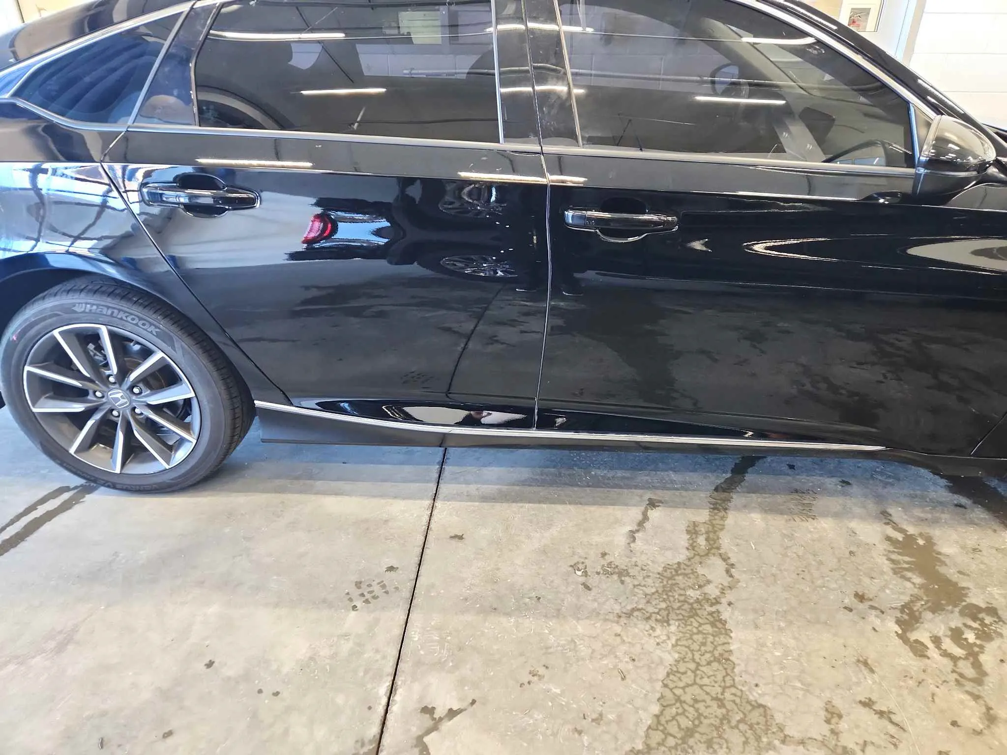 Black sedan after door repair