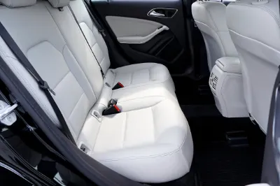 Technician restoring vehicle interior surfaces