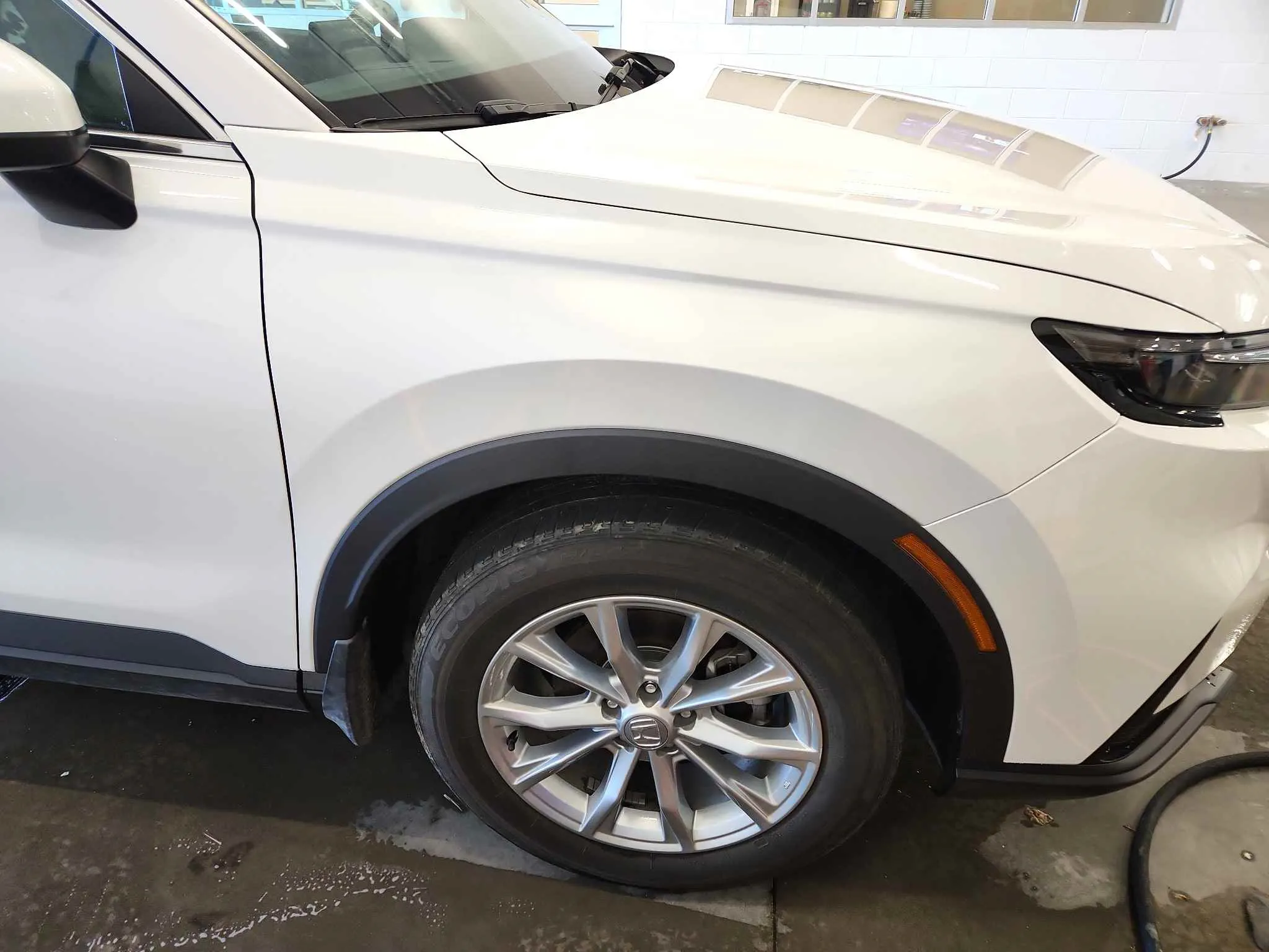 White vehicle after front bumper repair