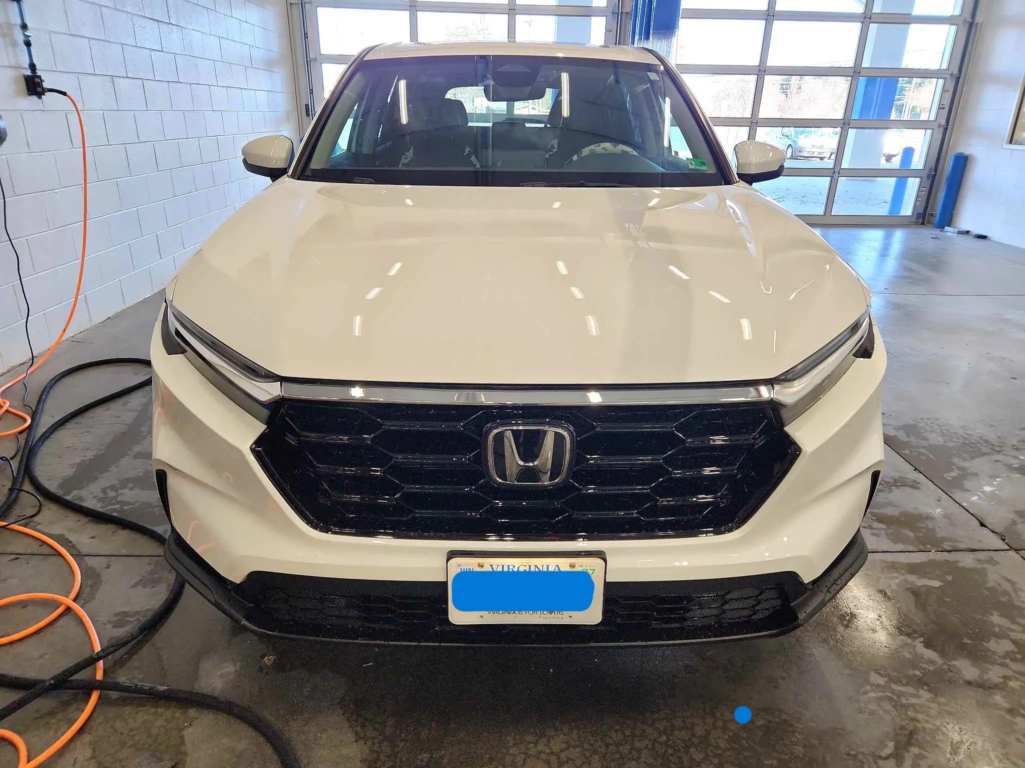 White Honda SUV after front collision repair