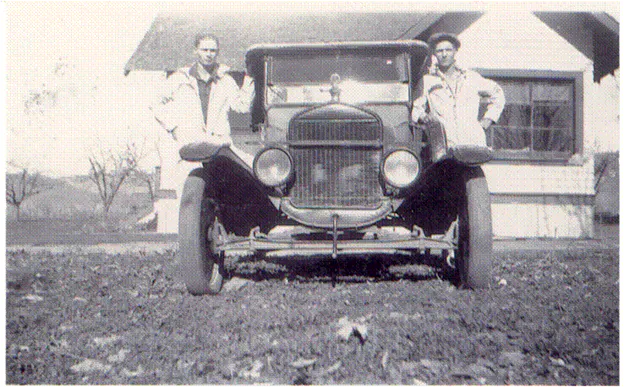 Founders Loy and Roy Cabe standing by their Toyota Vehicle