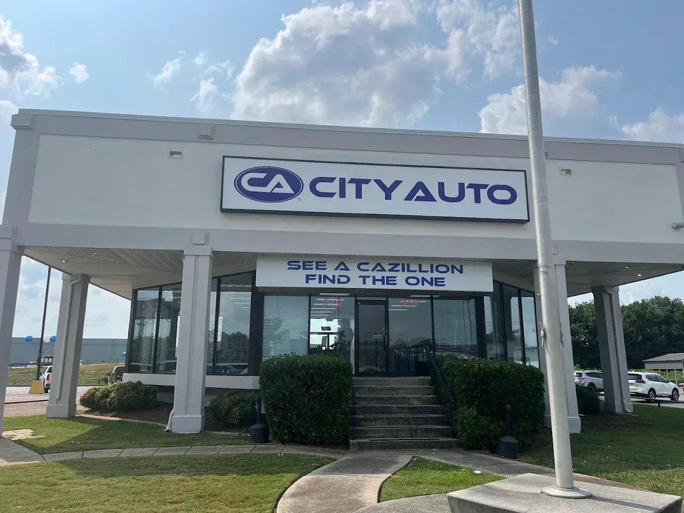 Front entrance of City Auto Chattanooga beneath the See A CAzillion, Find the One sign