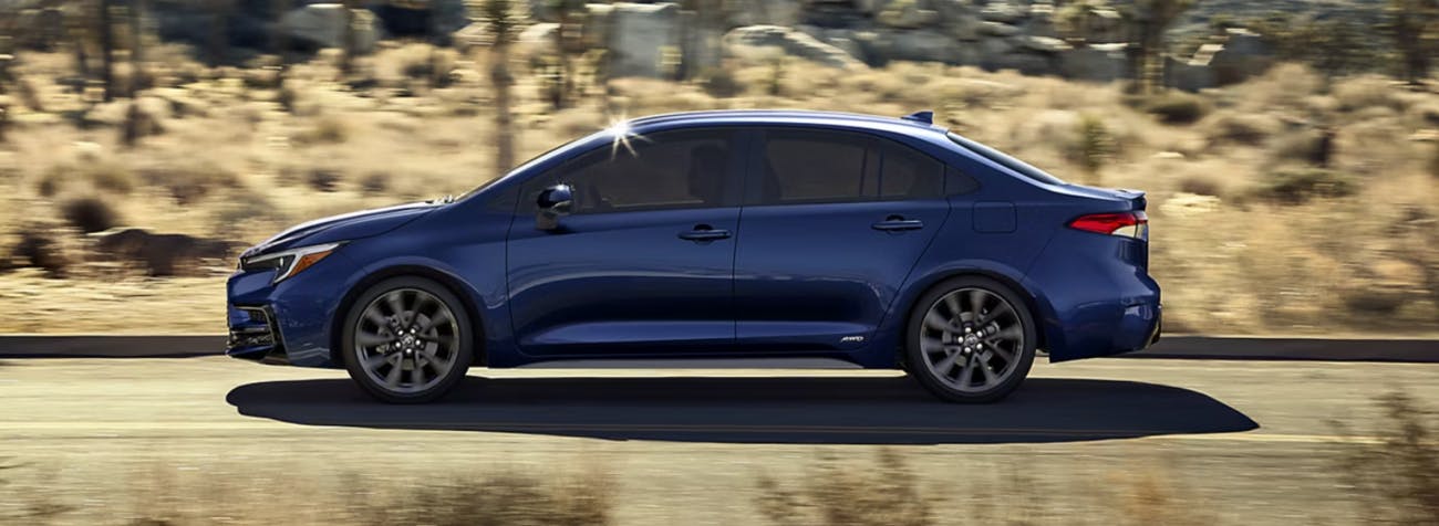 Toyota Corolla driving on a road