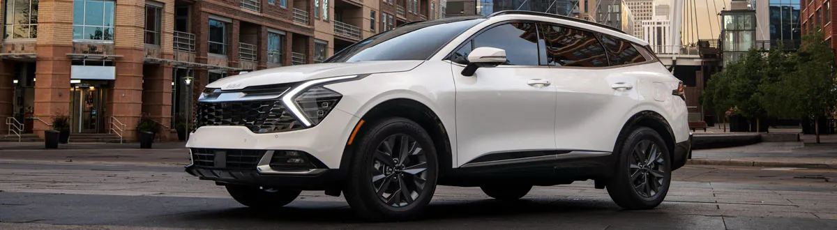 White Kia Sportage SUV Parked in City