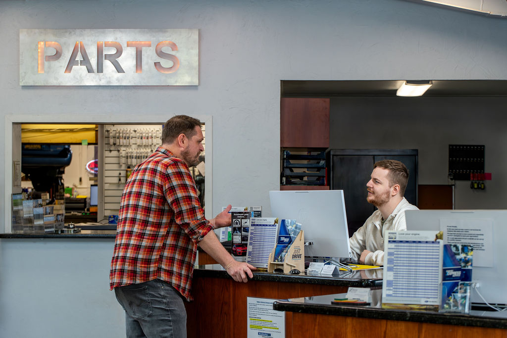 Customer talking with a parts specialist at the Juneau Auto Mall parts counter