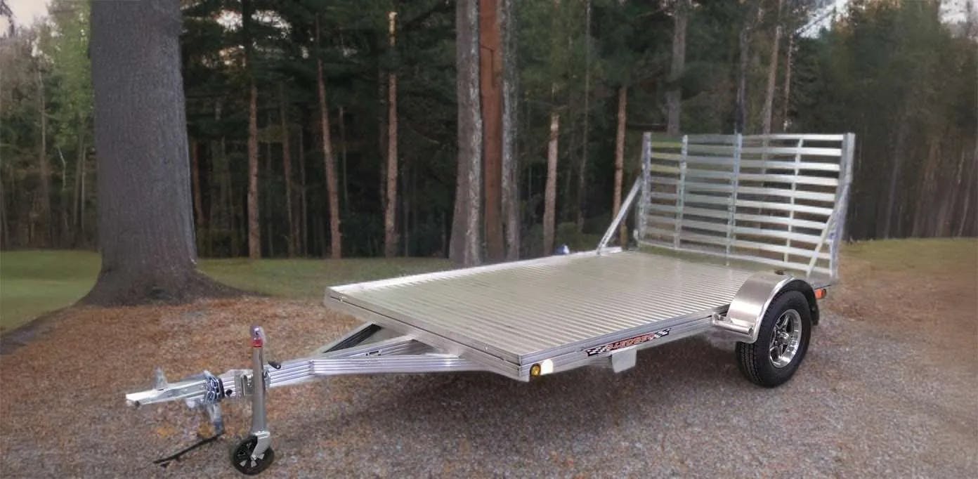 Utility trailer in wooded setting