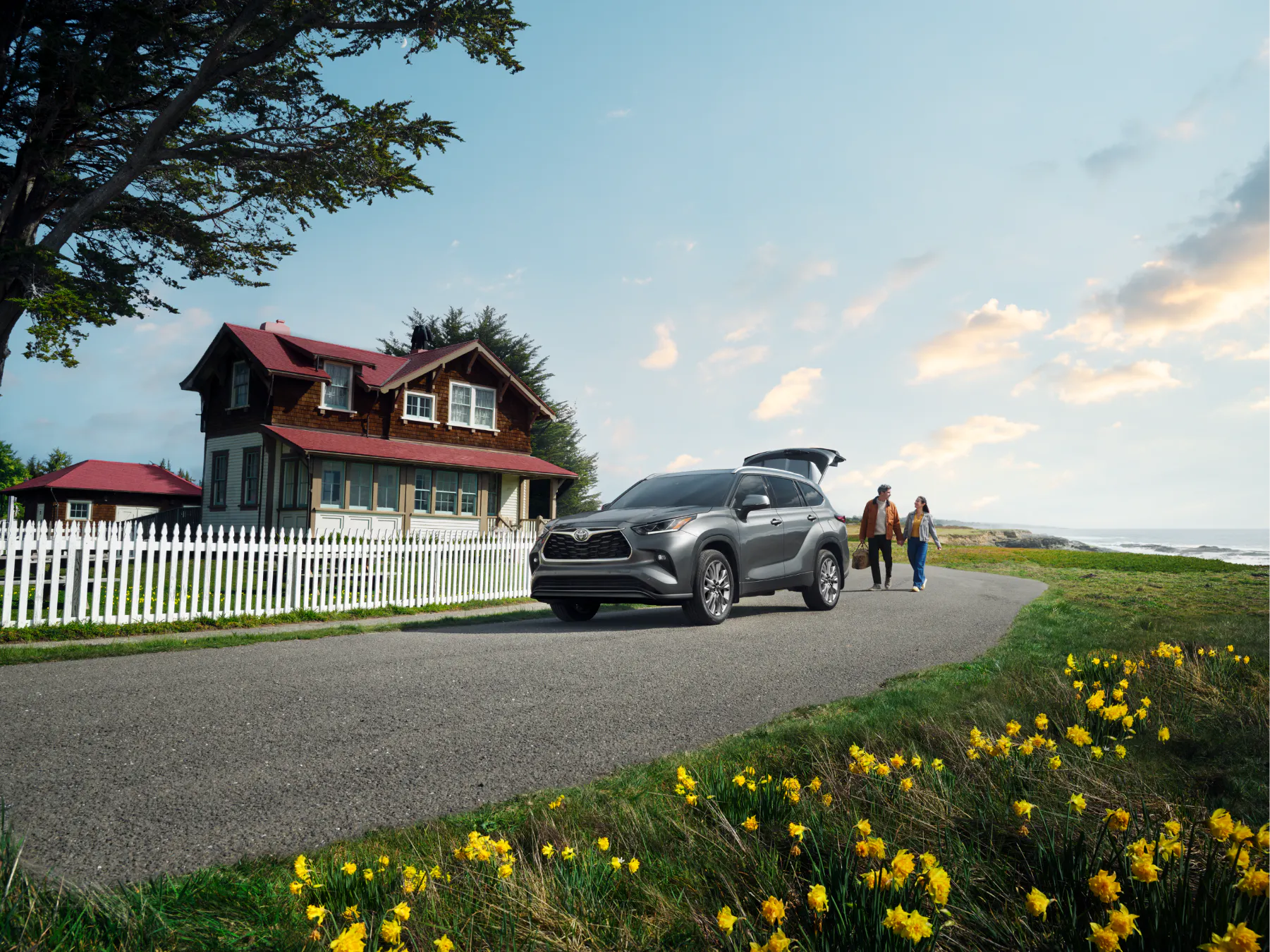 Gray Toyota Highlander parked at a coastal home in spring, a scene familiar to Juneau families