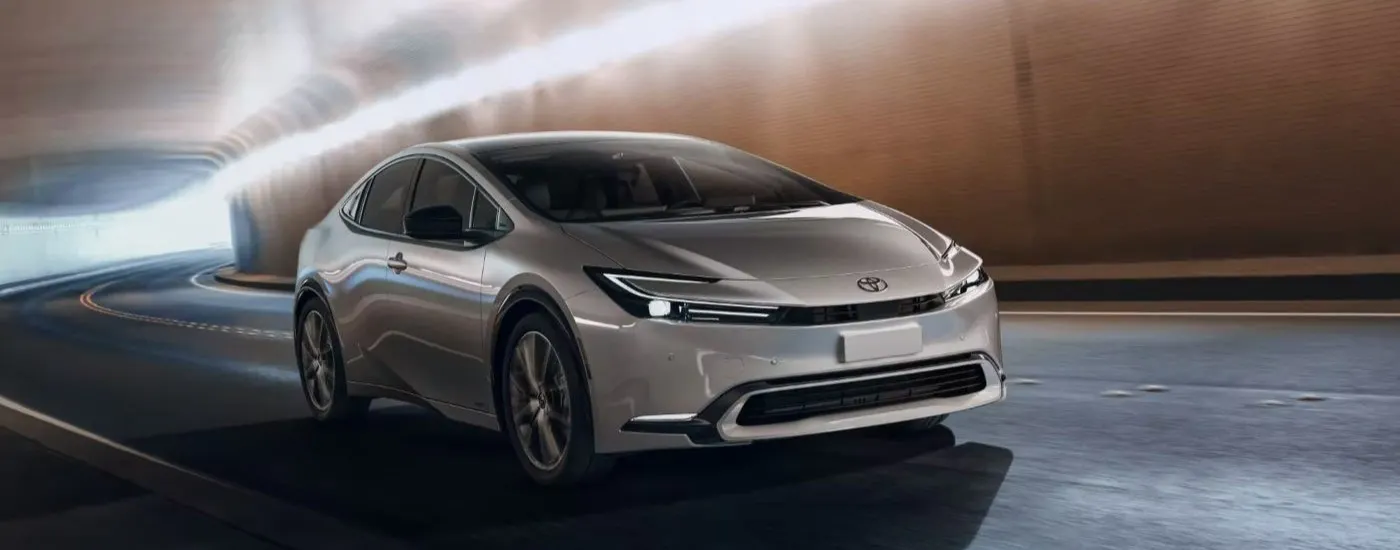 Silver 2023 Toyota Prius driving through a tunnel