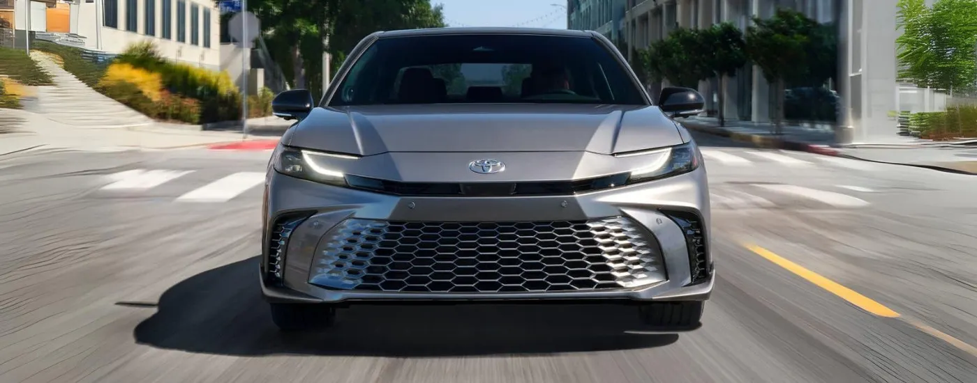 Grey 2026 Toyota Camry XSE driving through a city