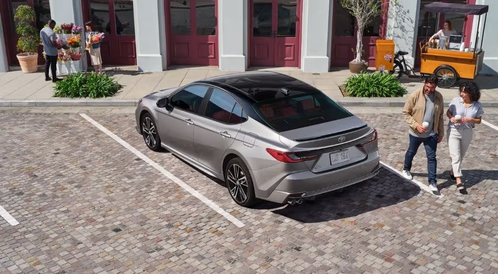 A tan 2025 Toyota Camry parked in a space.