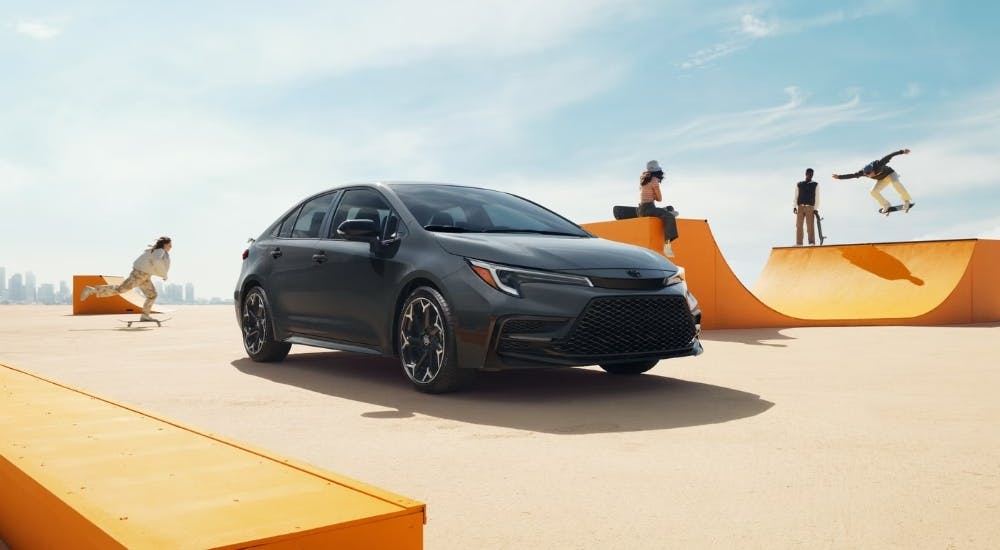 Black 2026 Toyota Corolla for sale near Atlanta near a skate park.