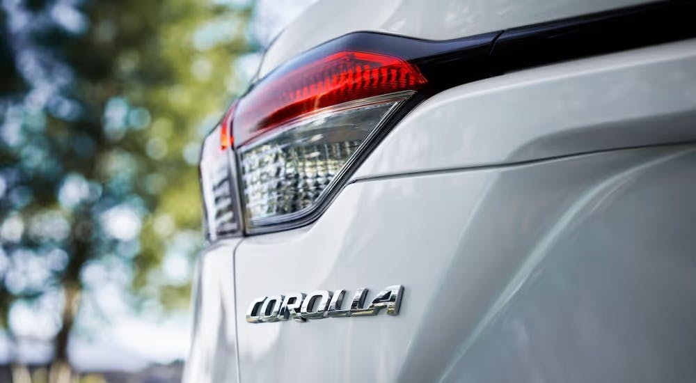 A white 2025 Toyota Corolla from the rear.