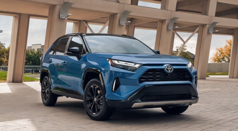 Blue 2025 Toyota RAV4 Hybrid parked at an angle for sale in Woodstock