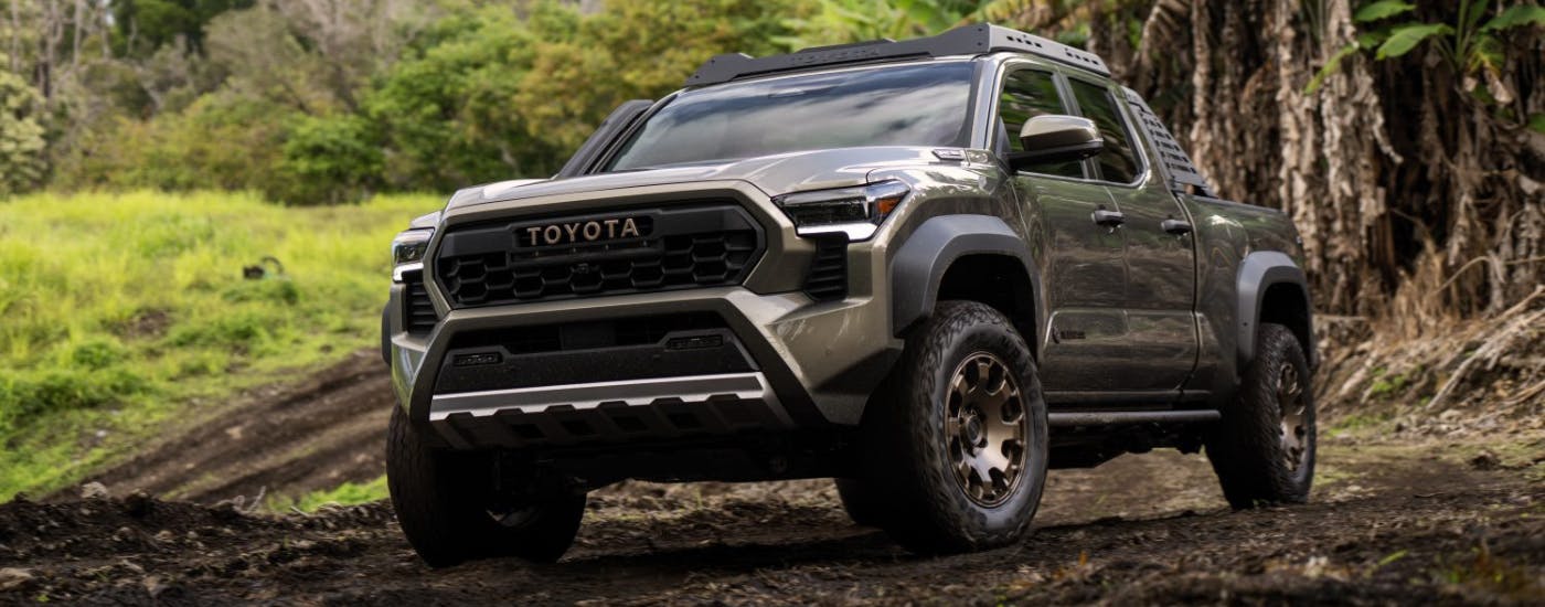 Green 2025 Toyota Tacoma Trail Hunter parked off-road