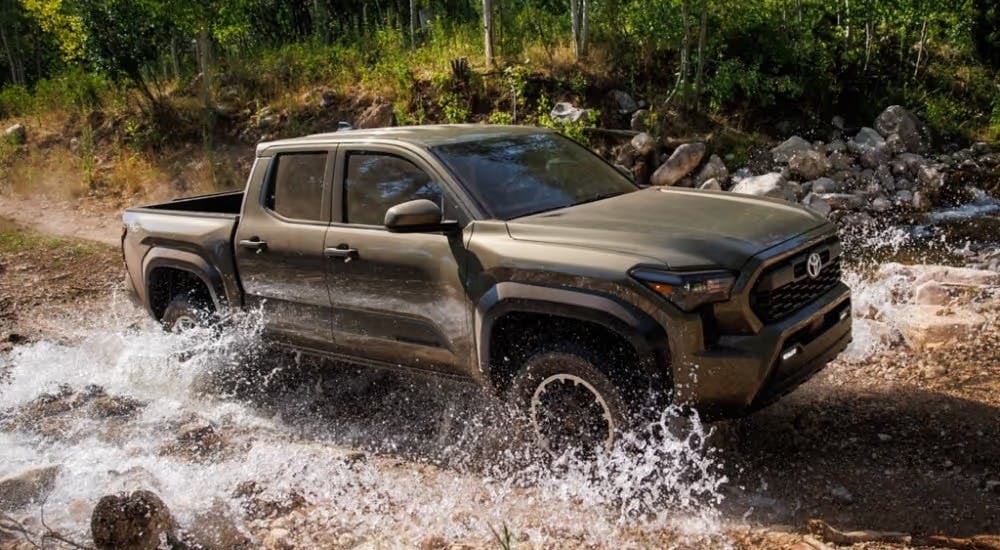 A brown 2025 Toyota Tacoma for sale near Sandy Springs from the front.