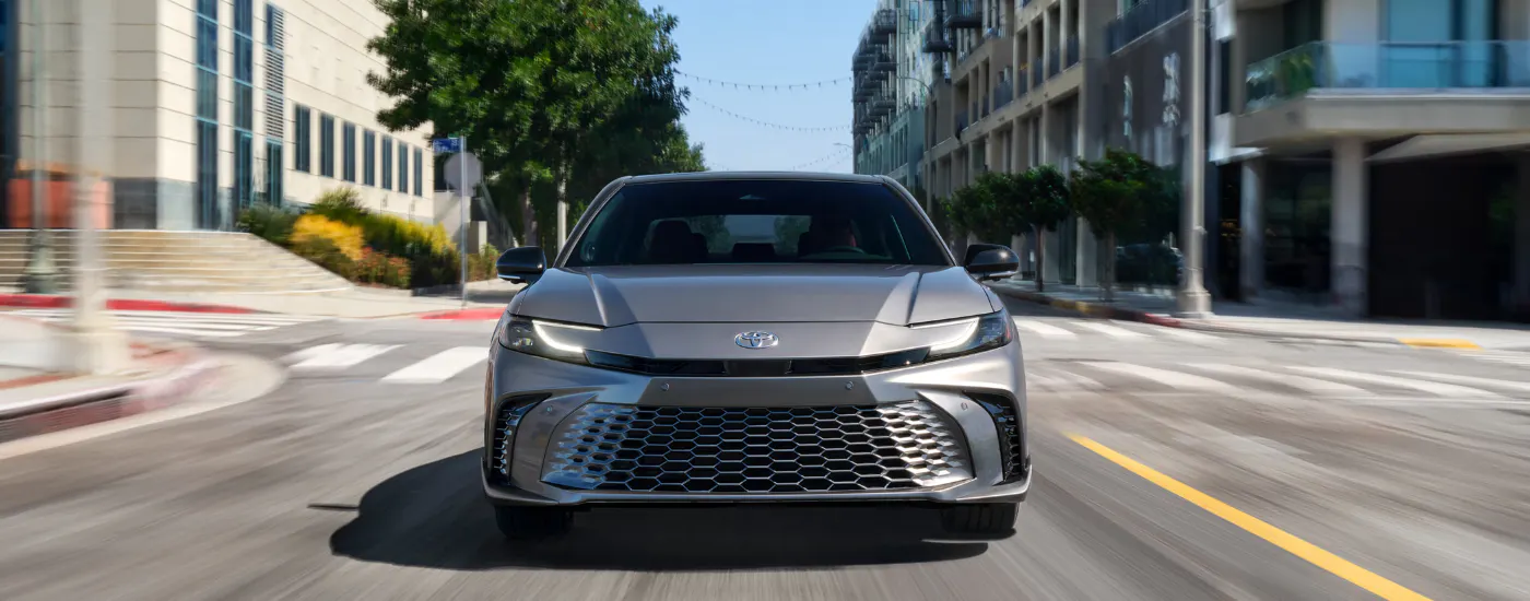 Grey 2026 Toyota Camry XSE driving through a city