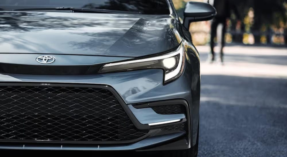 Headlight of a grey 2026 Toyota Corolla.