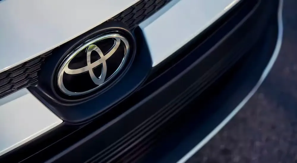 Close-up of the Toyota emblem on a 2023 Toyota Corolla LE for sale near Atlanta