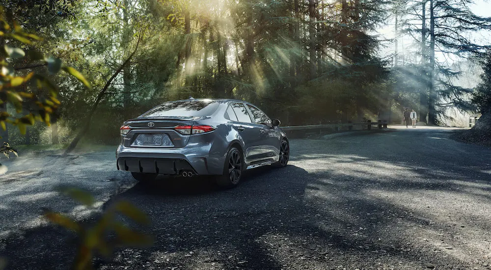 A grey 2020 Toyota Corolla XSE parked off-road near a trail