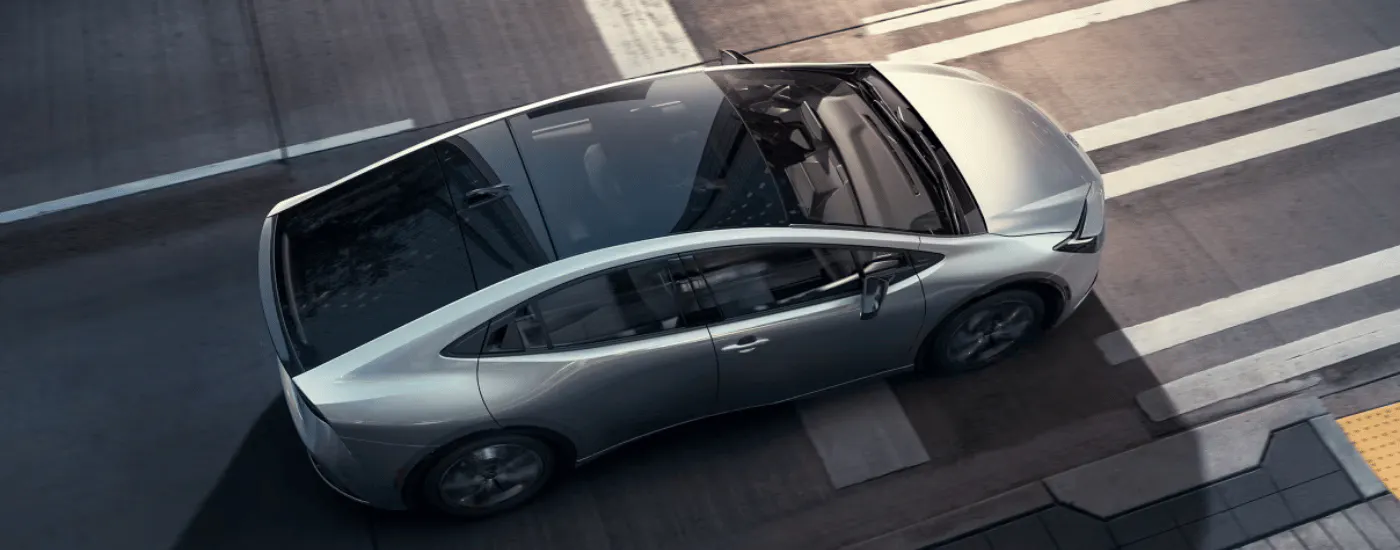 Silver 2026 Toyota Prius driving through a city form above