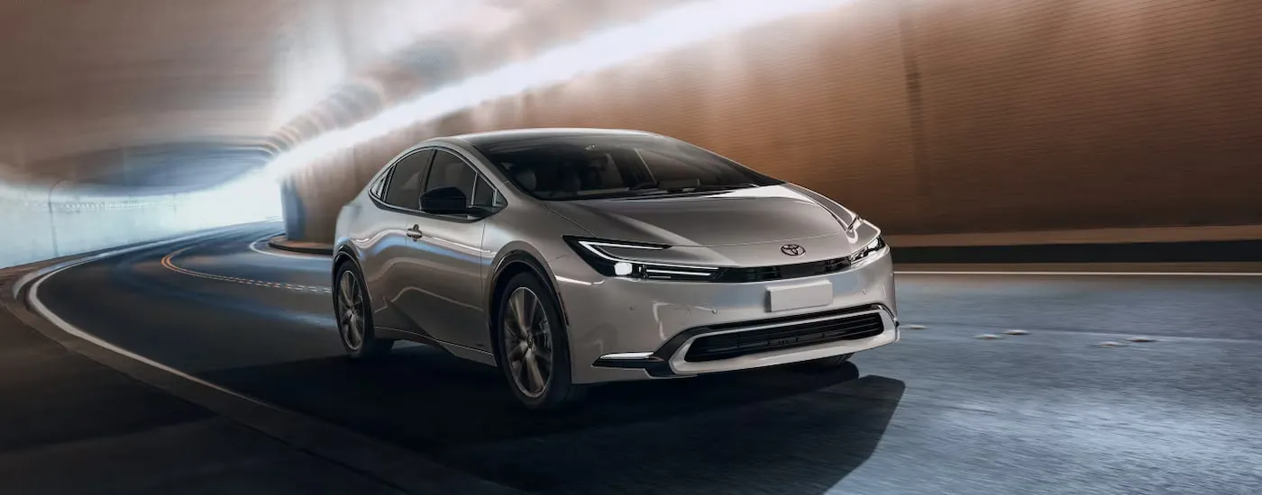 Silver 2026 Toyota Prius driving through a tunnel.