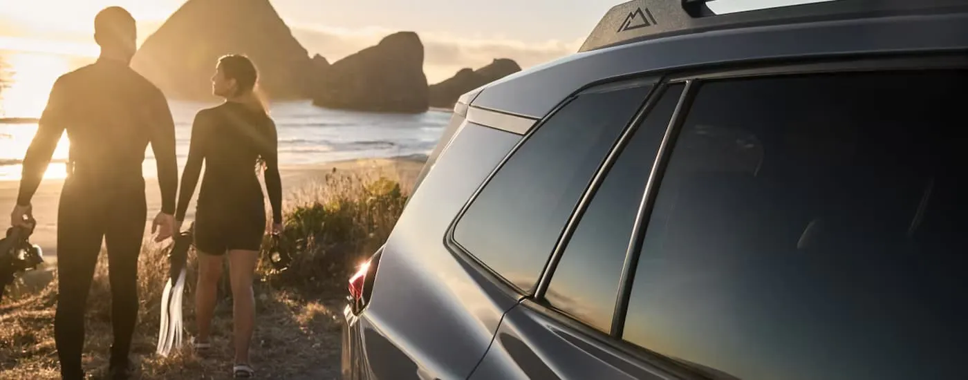 Side of a grey 2026 Toyota RAV4 near a beach