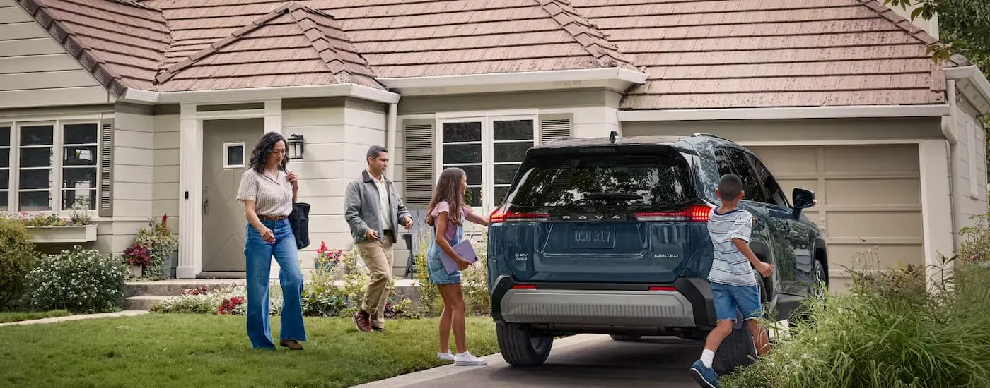 Blue 2026 Toyota RAV4 parked in a driveway