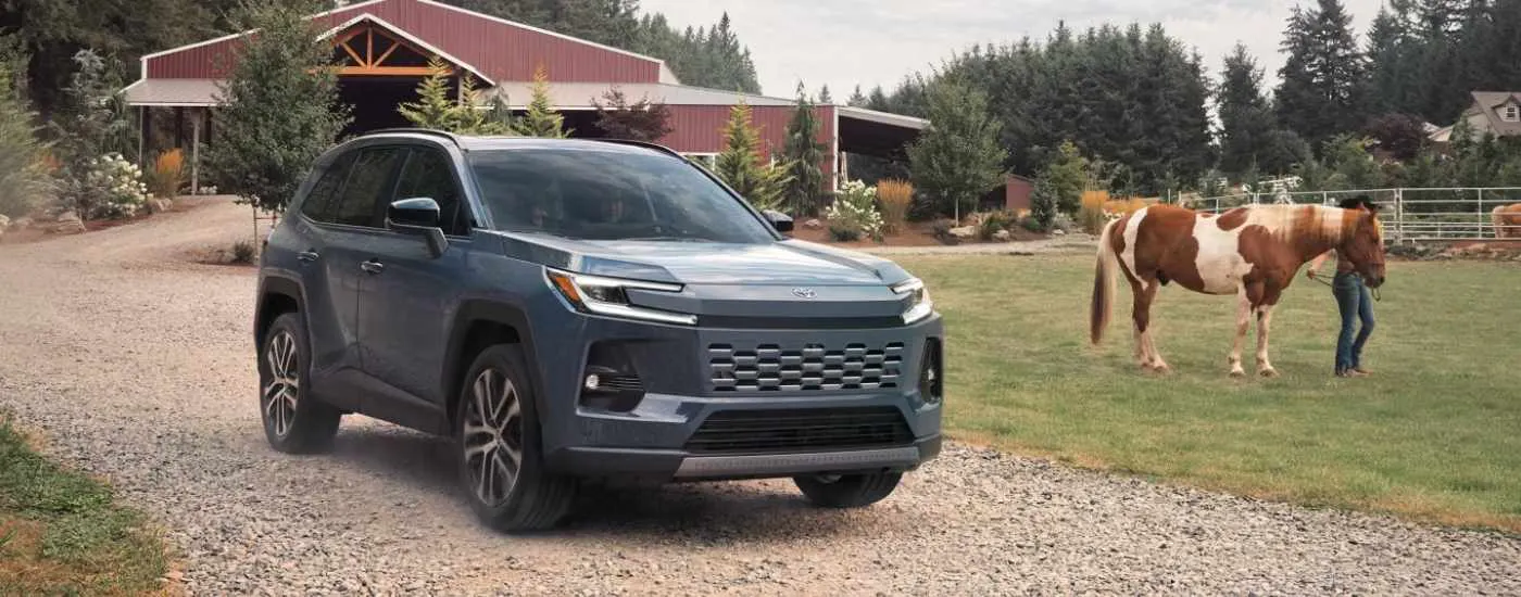 Grey 2026 Toyota RAV4 parked on a farm