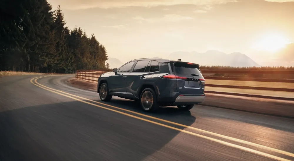 Blue 2026 Toyota RAV4 Limited for Sale near Cartersville rounding a corner