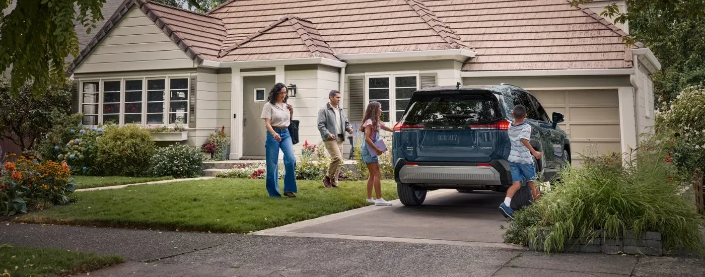Family getting into a grey 2026 Toyota RAV4 Limited