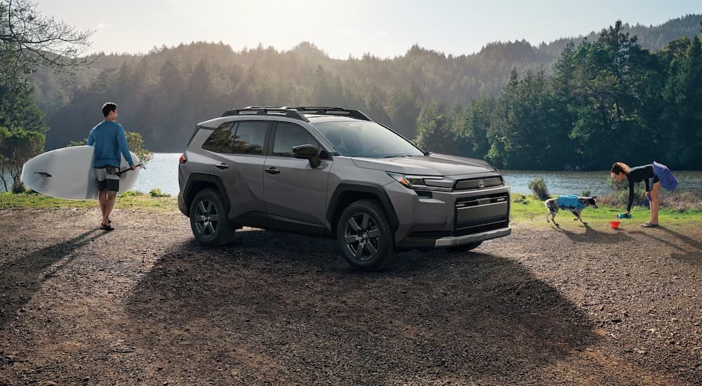 Grey 2026 Toyota RAV4 parked near a lake.