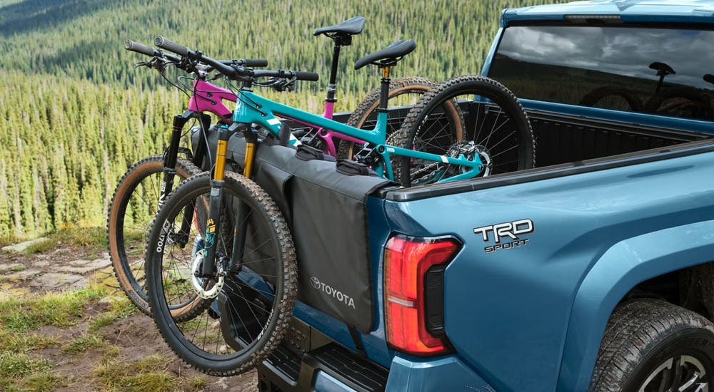 Bikes in the bed of a blue 2026 Toyota Tacoma