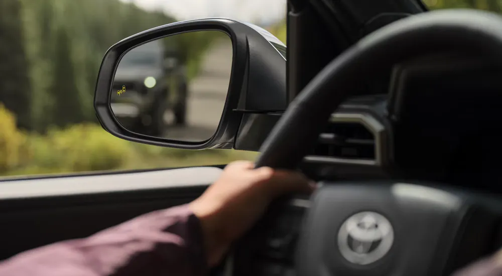 Side mirror and steering wheel in a 2026 Toyota Tacoma