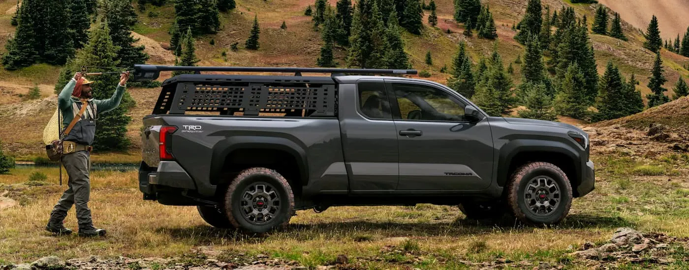 Side of a black 2026 Toyota Tacoma TRD parked off-road.