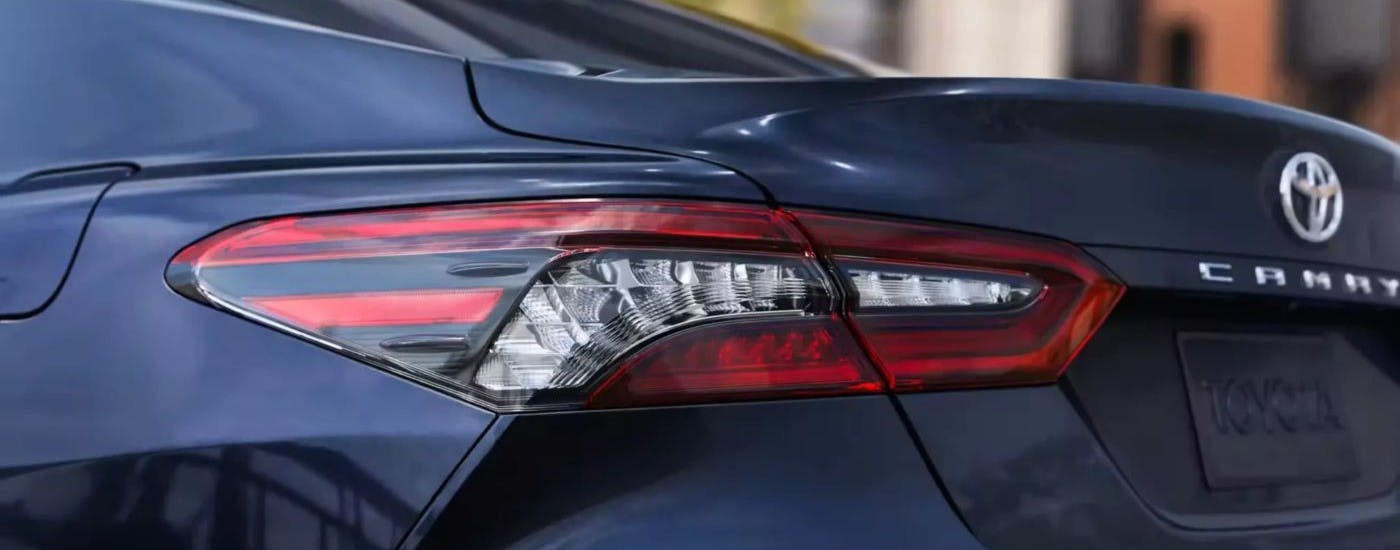 Close-up of a taillight on a blue 2024 Toyota Camry XLE