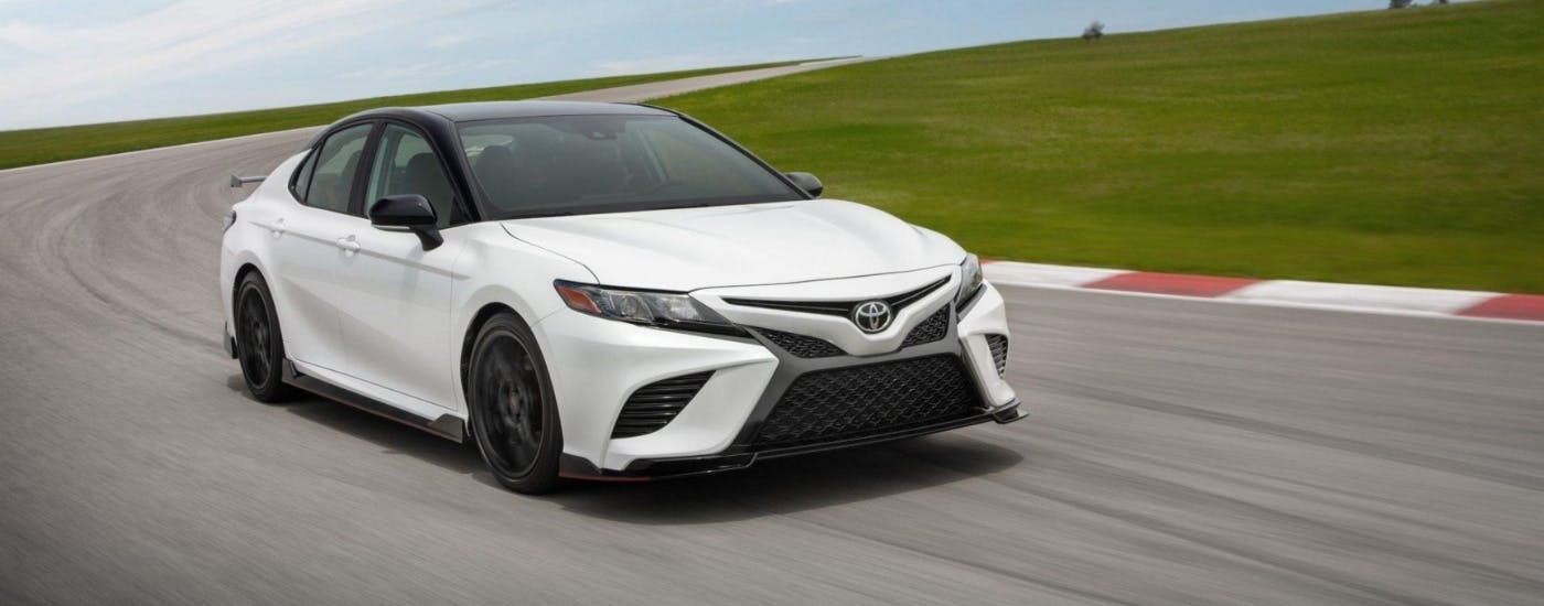 White 2024 Toyota Camry TRD for sale near Kennesaw driving on a track