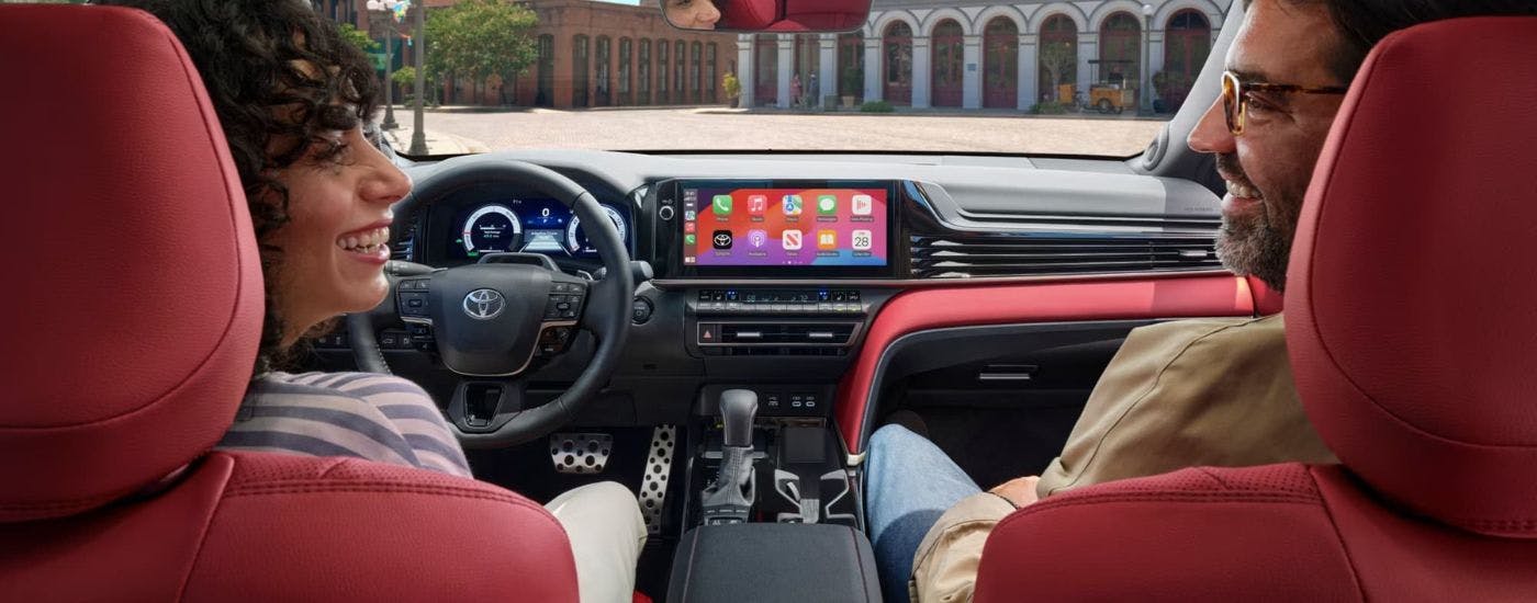People sitting in the interior of a 2025 Toyota Camry.