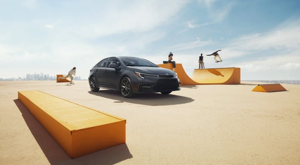 Gray 2026 Toyota Corolla SE parked at a skate park