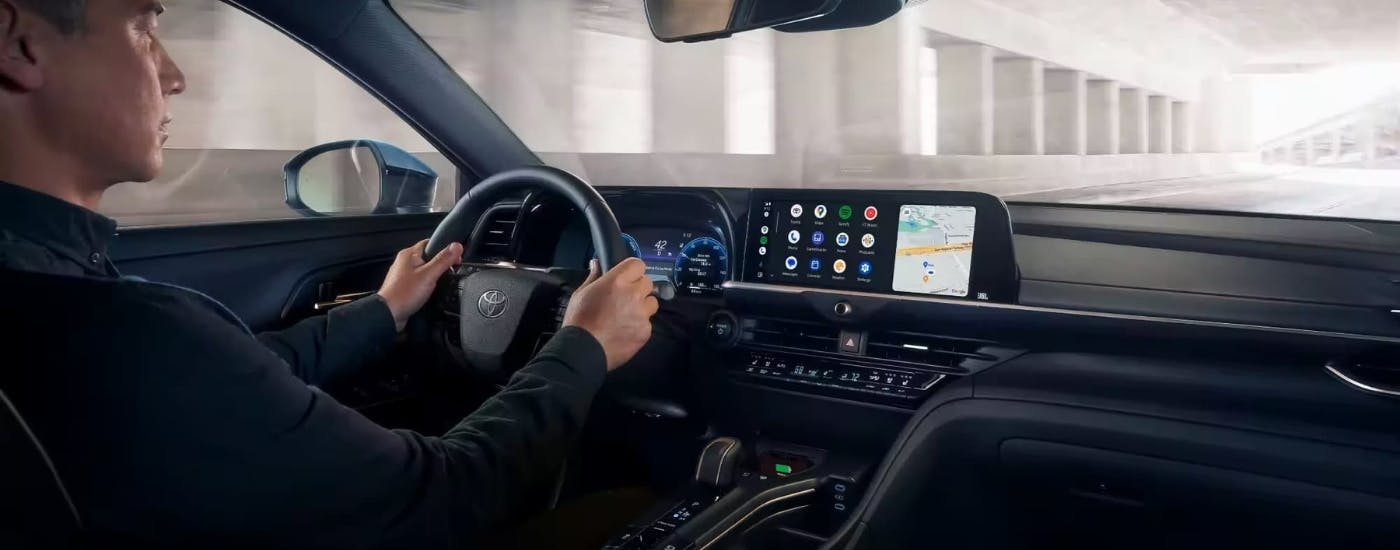 Person steering a 2023 Toyota Crown Platinum