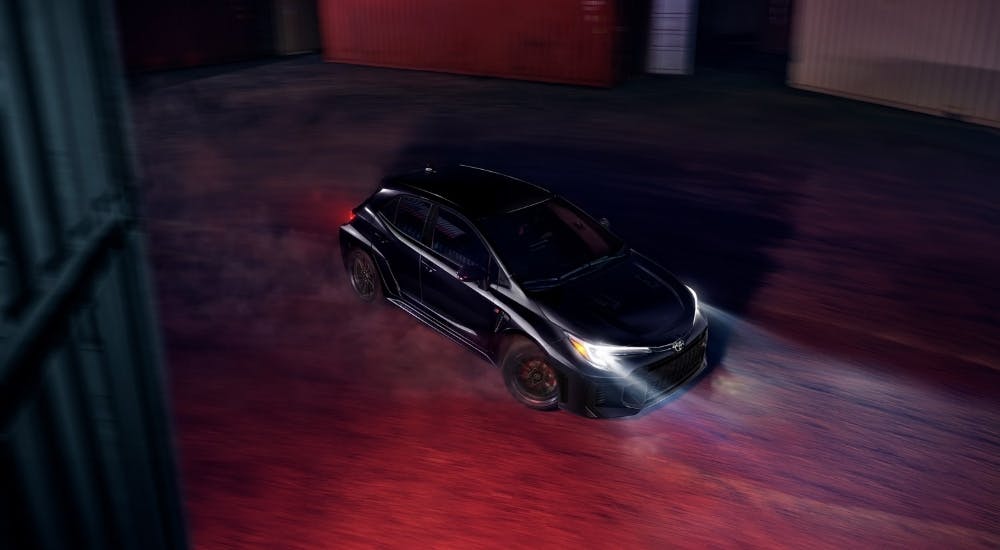 Black 2025 Toyota GR Corolla driving to a Toyota dealer near Acworth