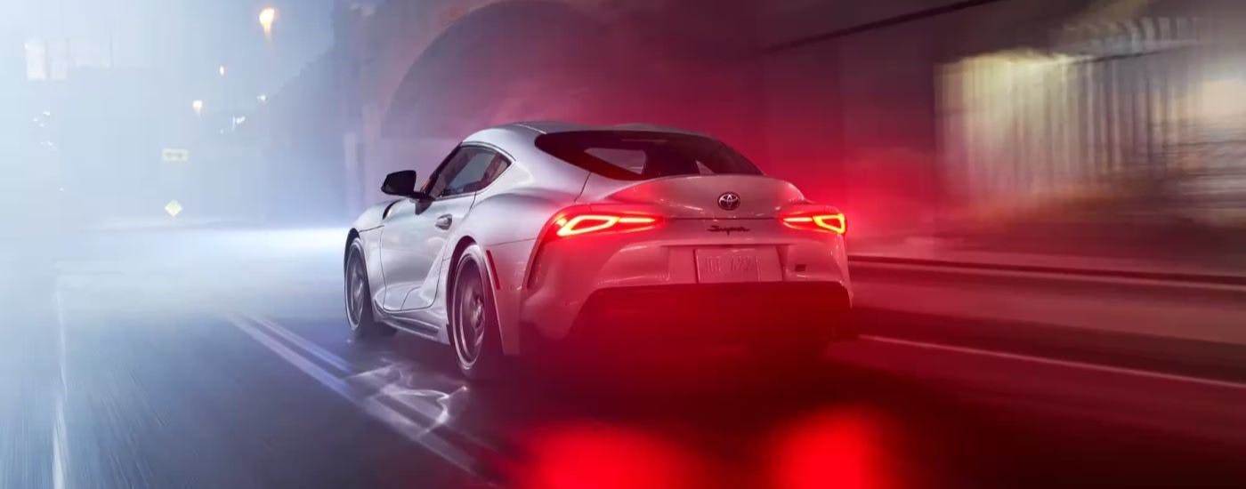 White 2023 Toyota GR Supra driving at night