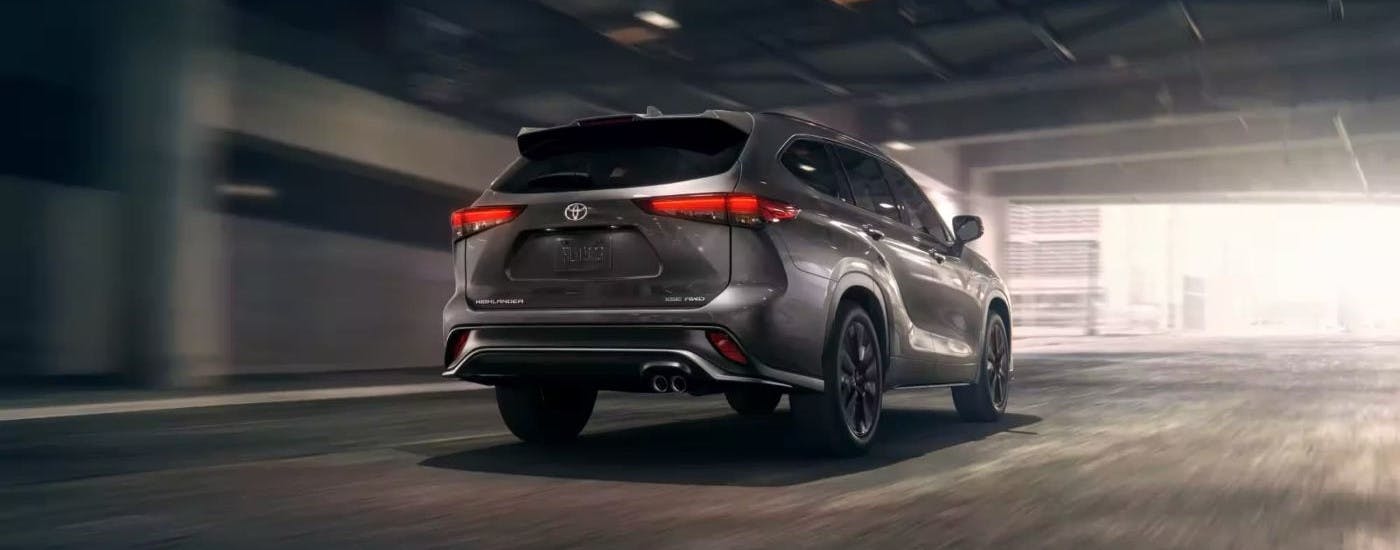 Silver 2024 Toyota Highlander XSE driving in a tunnel