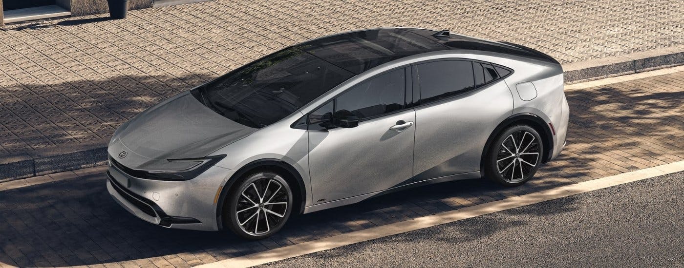 Silver 2024 Toyota Prius parked near a Toyota dealer near Vinings