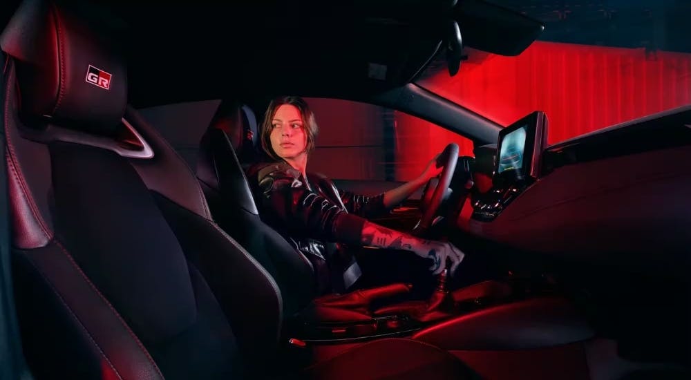 The black interior and dash are shown in a 2025 Toyota GR Corolla for sale.