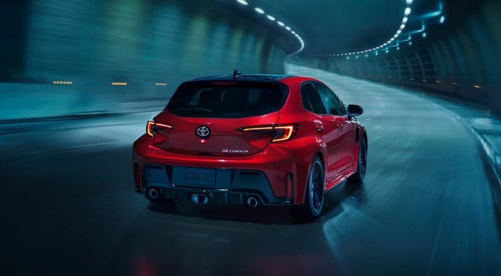 Red 2025 Toyota GR Corolla for sale driving in a tunnel
