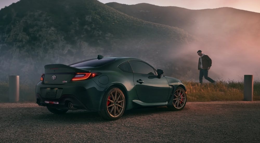 Green 2025 Toyota GR86 Hakone Edition is shown parked near a mountain